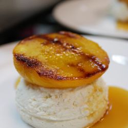 Grilled peaches over vanilla bean ice cream.