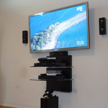 Acoustical Vision - Transformed a mundane wall into the center of the entertainment experience. - Home Theatre Installation Near Me - Forest Park, Illinois Acoustical Vision - Transformed a mundane wall into the center of the entertainment experience. - Home Theatre Installation Near Me - Forest Park, Illinois