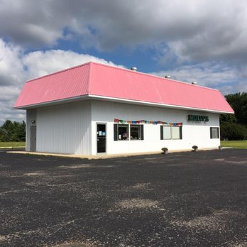Molly's Foods Unique - a white building with a pink roof - Health Markets Near Me - Bloomington, Indiana Molly's Foods Unique - a white building with a pink roof - Health Markets Near Me - Bloomington, Indiana