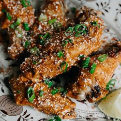 NewVida Preserve - Chili-Lime Elote Wings  7 wings fried & tossed in a chili lime sauce, roasted corn, cotija cheese, jalapeños, lime