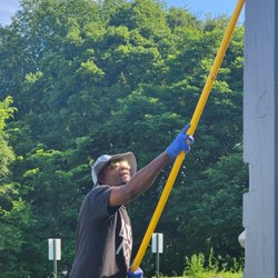 Antwans Handyman Service - Antwan painting hard to reach areas of house