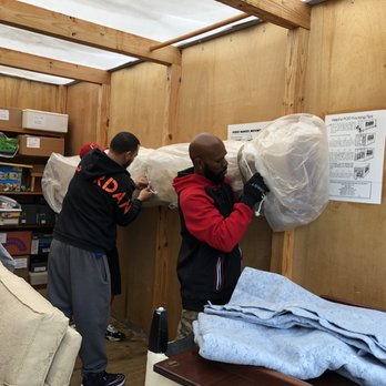 Good Guy Movers - Hanging the rug against side of pod. - Movers Near Me - Worcester, Massachusetts