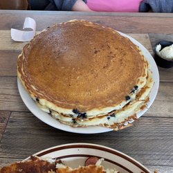 Our Place Cafe - Blueberry pancakes and a Kielbasa Omelette with hash brown potatoes.