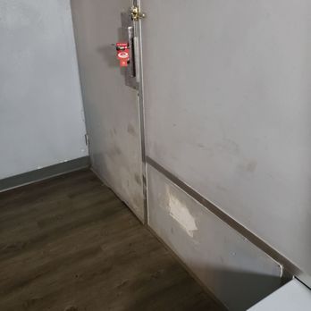Econo Lodge - Patched up, damaged door. - Hotels Near Me - Durant, Oklahoma