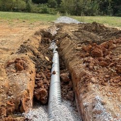 M&M Excavating - New gutter drains installed for local business.