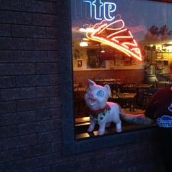 My piggle in front of Filippo's. His face mirrors my own after eating