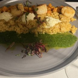 Seared scallops over sweet potato risotto & pesto. Seared scallops over sweet potato risotto & pesto.