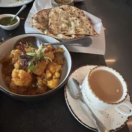 Aloo Gobi, Garlic Naan, and tea Aloo Gobi, Garlic Naan, and tea