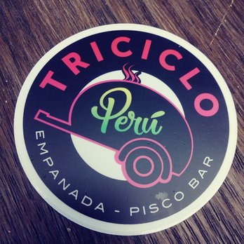 Triciclo Peru Express - a sticker on a wooden table - Empanadas Near Me - Milwaukee, Wisconsin