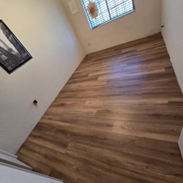The new flooring in one of the bedrooms