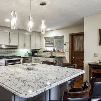 Kitchen Solvers - a kitchen with granite countertops and stainless steel appliances - General Contractors Near Me - Winnipeg, Manitoba Kitchen Solvers - a kitchen with granite countertops and stainless steel appliances - General Contractors Near Me - Winnipeg, Manitoba