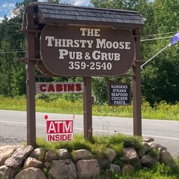 a sign for the thirsty moose pub and grub a sign for the thirsty moose pub and grub