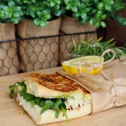 The Squeeze at the Beach - Lemon Chicken Pesto Grilled chicken, fresh greens, and flavorful pesto on warm, toasted bread.