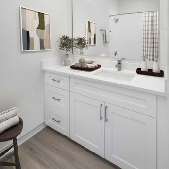 Camden Addison Apartments - Bathroom with white quartz countertop and white shaker cabinets at Camden Addison apartments in Addison, TX - Apartments Near Me - Addison, Texas Camden Addison Apartments - Bathroom with white quartz countertop and white shaker cabinets at Camden Addison apartments in Addison, TX - Apartments Near Me - Addison, Texas