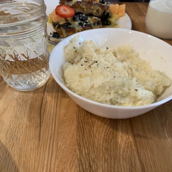 Water for Chocolate - Grits, raisin bread french toast (background) - Breakfast & Brunch Near Me - Baltimore, Maryland Water for Chocolate - Grits, raisin bread french toast (background) - Breakfast & Brunch Near Me - Baltimore, Maryland