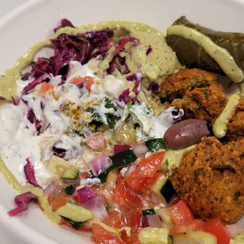 Hummus Republic - Bowl with falafel, tzaziki and couscous+kale base - Mediterranean Near Me - Bellevue, Washington Hummus Republic - Bowl with falafel, tzaziki and couscous+kale base - Mediterranean Near Me - Bellevue, Washington