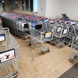 a large number of shopping carts in a store a large number of shopping carts in a store