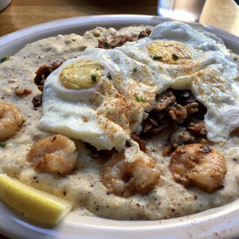 Pine State Biscuits - Shrimp and grits with two fried eggs on top. - Breakfast & Brunch Near Me - Portland, Oregon