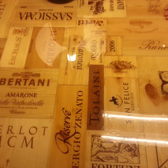 Enoteca Alessi - one of the tables made out of wine boxes with a glass on top - Coffee & Tea Near Me - Florence, FI