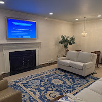 Rtechwork - Professional TV mounting above fireplace in a living room by Rtechwork. - Home Theatre Installation Near Me - Grosse Pointe, Michigan Rtechwork - Professional TV mounting above fireplace in a living room by Rtechwork. - Home Theatre Installation Near Me - Grosse Pointe, Michigan