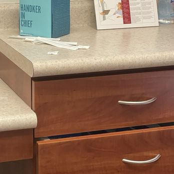 MD Now Urgent Care - Garbage overflowing with syringes, dirty countertops from prior patient supplies - Urgent Care Near Me - Boca Raton, Florida