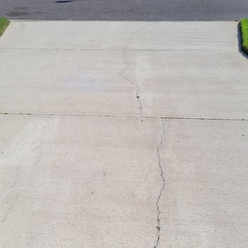 Shark Coatings - The existing concrete driveway crack before the Shark Skin Coating crack repair and surface application. - Flooring Near Me - Jacksonville, Florida Shark Coatings - The existing concrete driveway crack before the Shark Skin Coating crack repair and surface application. - Flooring Near Me - Jacksonville, Florida