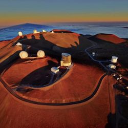 W M Keck Observatory - Keck's twin telescopes (left midground) on northern stretch of 14K'h Mauna Kea Access Rd. Visitor's Gallery & bathrooms open 10:00am-2:30pm.