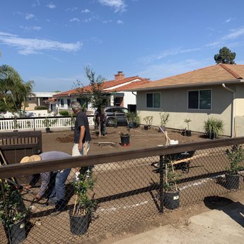 Grass Doctor Landscape - two people working on a fenced in yard - Landscaping Near Me - Spring Valley, California