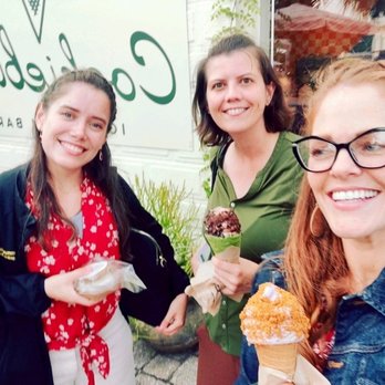 Cookiebird Ice Cream Bar - Three ladies holding an ice cream sandwich, a matcha cone with chocolate swirls and pitsachio crumbles, and a lavender ice cream cone. - Ice Cream & Frozen Yogurt Near Me - St. Augustine, Florida Cookiebird Ice Cream Bar - Three ladies holding an ice cream sandwich, a matcha cone with chocolate swirls and pitsachio crumbles, and a lavender ice cream cone. - Ice Cream & Frozen Yogurt Near Me - St. Augustine, Florida