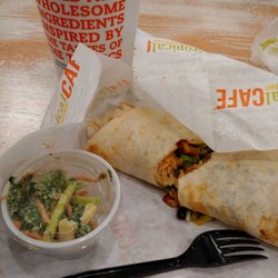 Tropical Smoothie Cafe - Jerk chicken wrap, kale apple slaw side. Detox smoothie