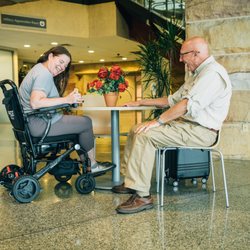 Hoosier Mobility Solutions - A lightweight foldable wheelchair also serves as a seat at the table