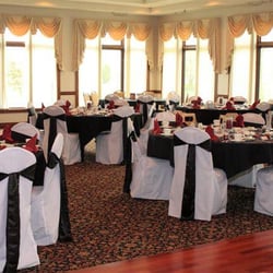 One Dollar Chair Cover Rentals - Banquet chair cover with black sash.