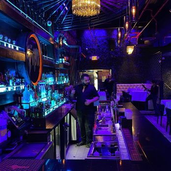 VIDA NYC Steakhouse - a bar with purple lighting - Steakhouses Near Me - Queens, New York