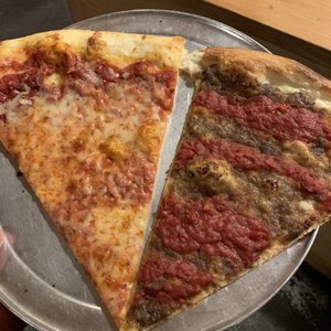 Photo of Sizzle Pie - Seattle, WA, United States. Cheesy goodness on the left, vegan Spiral Tap on the right :)