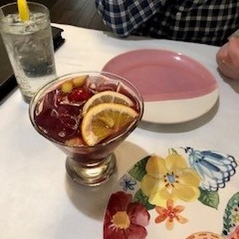 Thithi's Restaurant - Whimsical plates, different at each place setting.  Huge gin & 7uP and their famous red sangria. - Thai Near Me - Evergreen Park, Illinois