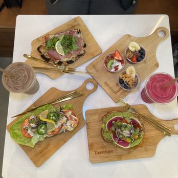 Toastique - (Left to right, clockwise): italian, smoothie bowl samples, classic avo, spicy crab - Juice Bars & Smoothies Near Me - Chesapeake, Virginia Toastique - (Left to right, clockwise): italian, smoothie bowl samples, classic avo, spicy crab - Juice Bars & Smoothies Near Me - Chesapeake, Virginia