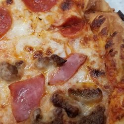 Pizza Inn - Italian crust, pepperoni with onion and italian sausage with ham.