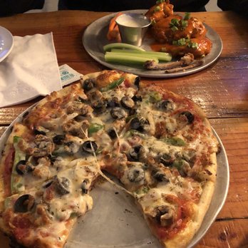 Dirt Road Brewing - Delicious Dirt Road pizza (minus the bacon) and my fiancé's wings in the background. Both absolutely wonderful! - Brewpubs Near Me - Philomath, Oregon Dirt Road Brewing - Delicious Dirt Road pizza (minus the bacon) and my fiancé's wings in the background. Both absolutely wonderful! - Brewpubs Near Me - Philomath, Oregon