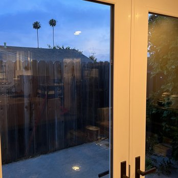 Fitzhauer Construction - Patio French door with external shutters pulled up. - Windows Installation Near Me - Anaheim, California Fitzhauer Construction - Patio French door with external shutters pulled up. - Windows Installation Near Me - Anaheim, California