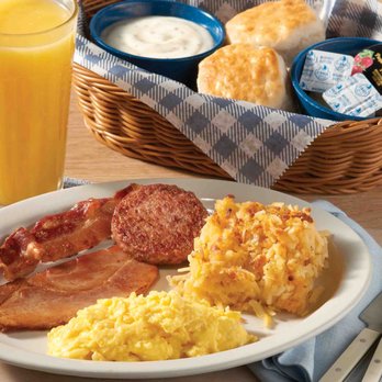 Cracker Barrel Old Country Store - a plate of eggs, bacon, hash browns, biscuits, and a glass of orange juice - American Near Me - Naples, Florida Cracker Barrel Old Country Store - a plate of eggs, bacon, hash browns, biscuits, and a glass of orange juice - American Near Me - Naples, Florida