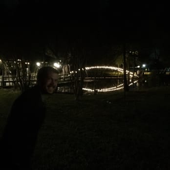 Cross Creek Ranch - Check out the sweet little bridge in the background, all lit up!! Don't mind my goof of a husband! - Venues & Event Spaces Near Me - Parker, Texas