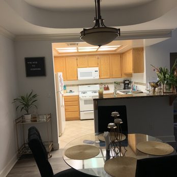 Conrad Property Management - Dining room with high ceilings and kitchen with plenty of cabinets and dishwasher! - Property Management Near Me - Los Angeles, California Conrad Property Management - Dining room with high ceilings and kitchen with plenty of cabinets and dishwasher! - Property Management Near Me - Los Angeles, California