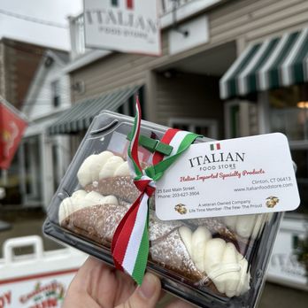 Italian Food Store - a hand holding a box of doughnuts - Olive Oil Near Me - Clinton, Connecticut