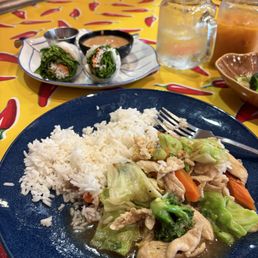 Fresh shrimp rolls with warm peanut sauce and  Garlic chicken with white rice.