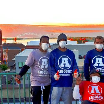Absolute Moving Services - Gary, Ferlandis, Courtney, and Allen on Barefoot Bride's rooftop after completing their move of 2,000+ wedding dresses! - Movers Near Me