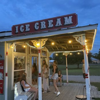 Arcadia Ice House - a group of people sitting outside - Ice Cream & Frozen Yogurt Near Me - Arcadia, Michigan