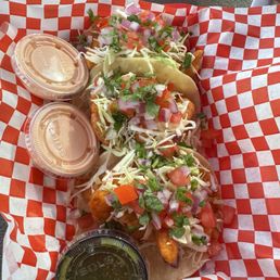 Two shrimp and one fish taco, green salsa spicy in a very good way.