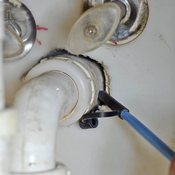 Invasive Pest Control - Precision pest control! Applying insecticide dust with a bulb duster to reach hidden pests where they hide and protect your home - Pest Control Near Me - Long Beach, California