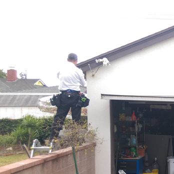 A Thorough Guy - Mike checking out the wiring in the garage. - Home Inspectors Near Me