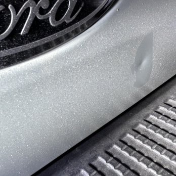 GNJ Auto Graphics - Dented tailgate behind spare tire that they removed - Auto Detailing Near Me - Knoxville, Tennessee